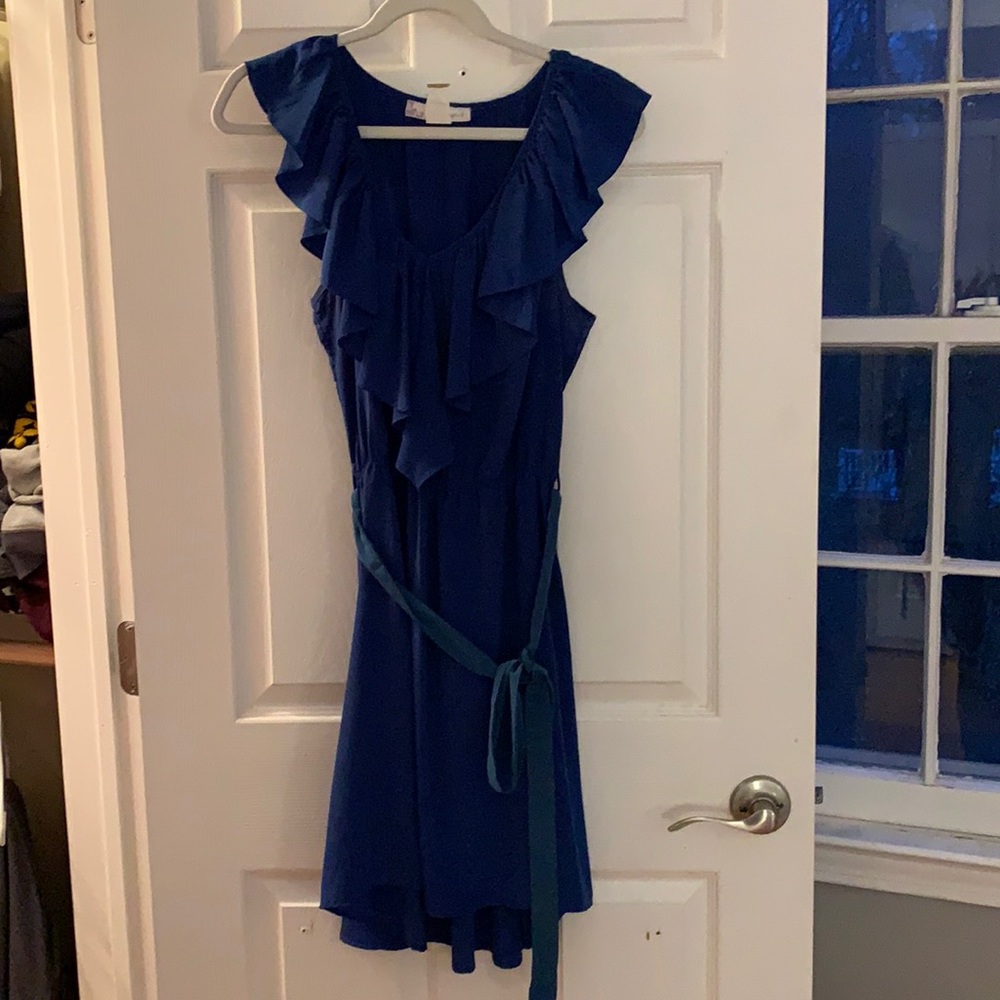 Blue ruffle dress with a slight high low bottom and a tie